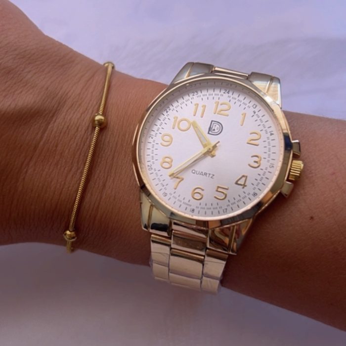 Reloj dorado metal