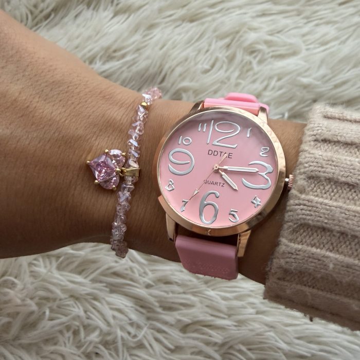 Reloj goma rosa borde dorado